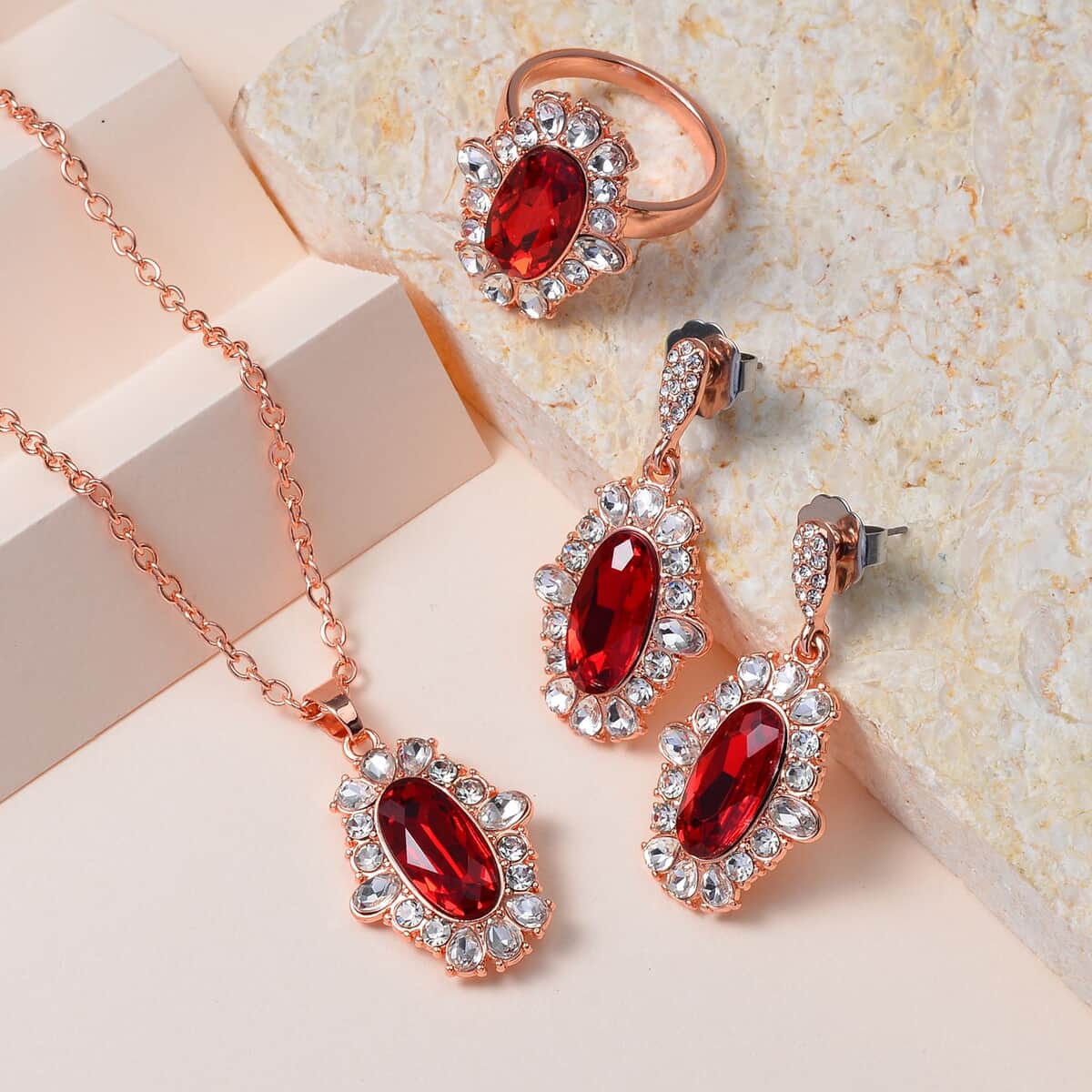 Simulated Ruby, Austrian Crystal Halo Ring (Size 7.00), Earrings and Pendant Necklace in Rosetone 20-22 Inches image number 1