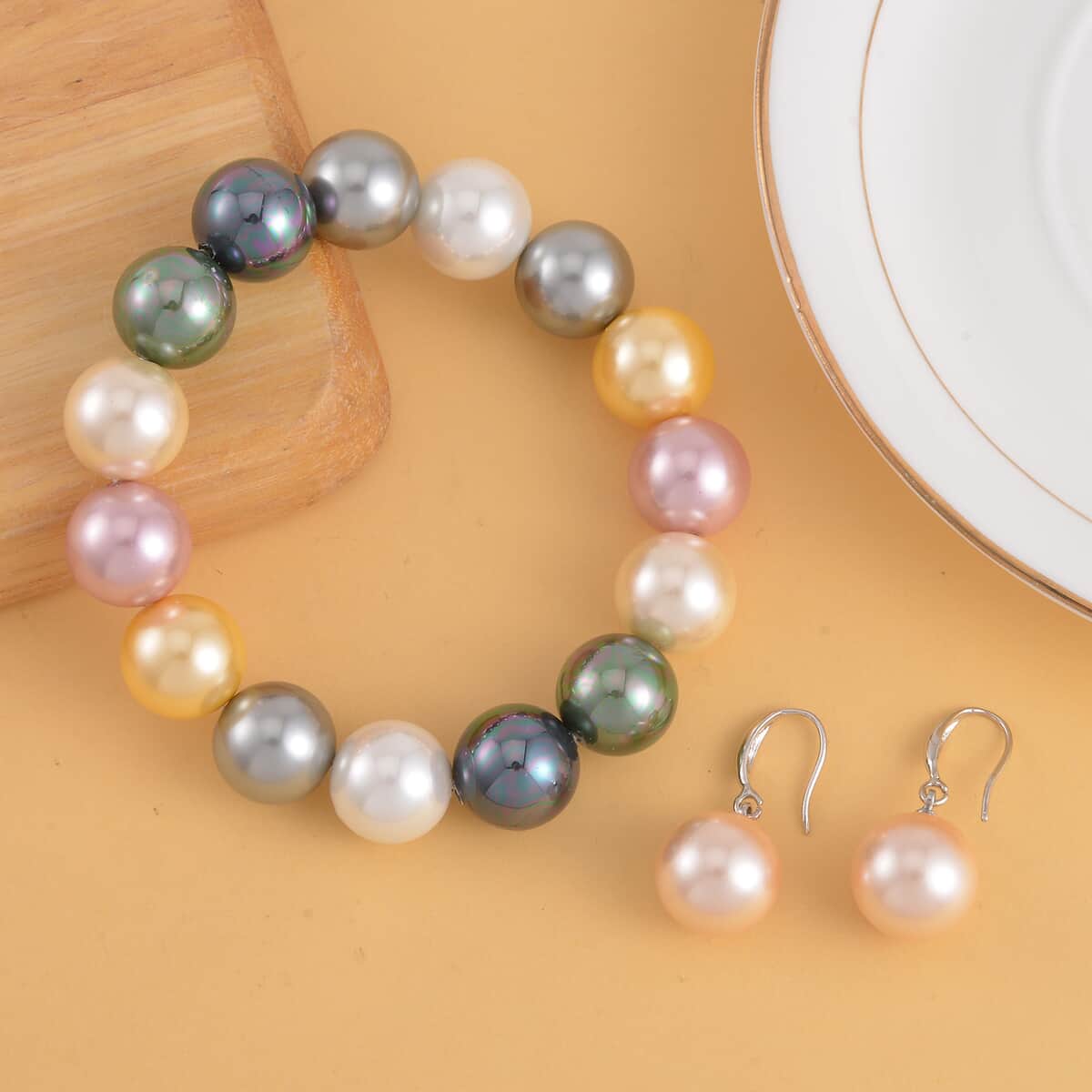Multi Color Shell Pearl Stretch Bracelet and Earrings in Silvertone image number 1