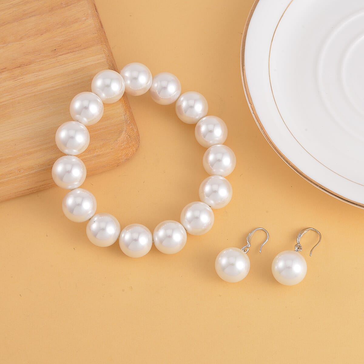White Shell Pearl Stretch Bracelet and Earrings in Silvertone image number 1