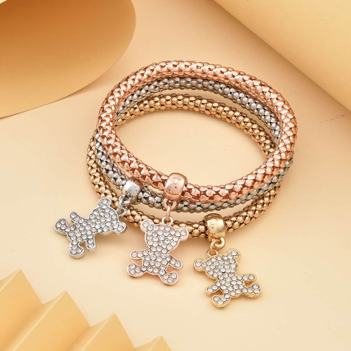 Set of 3 Austrian Crystal Pave Stretch Bracelet with Charm in Goldtone, Rosetone and Silvertone image number 1