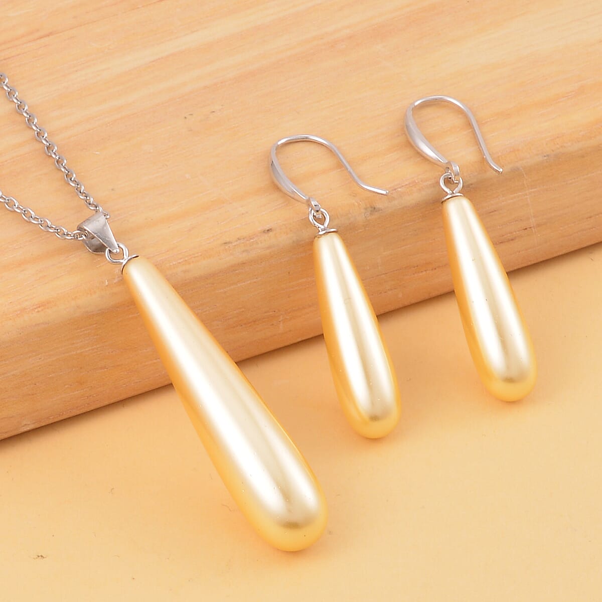 Golden Shell Pearl Drop Earrings and Pendant in Sterling Silver with Stainless Steel Necklace 20 Inches image number 1