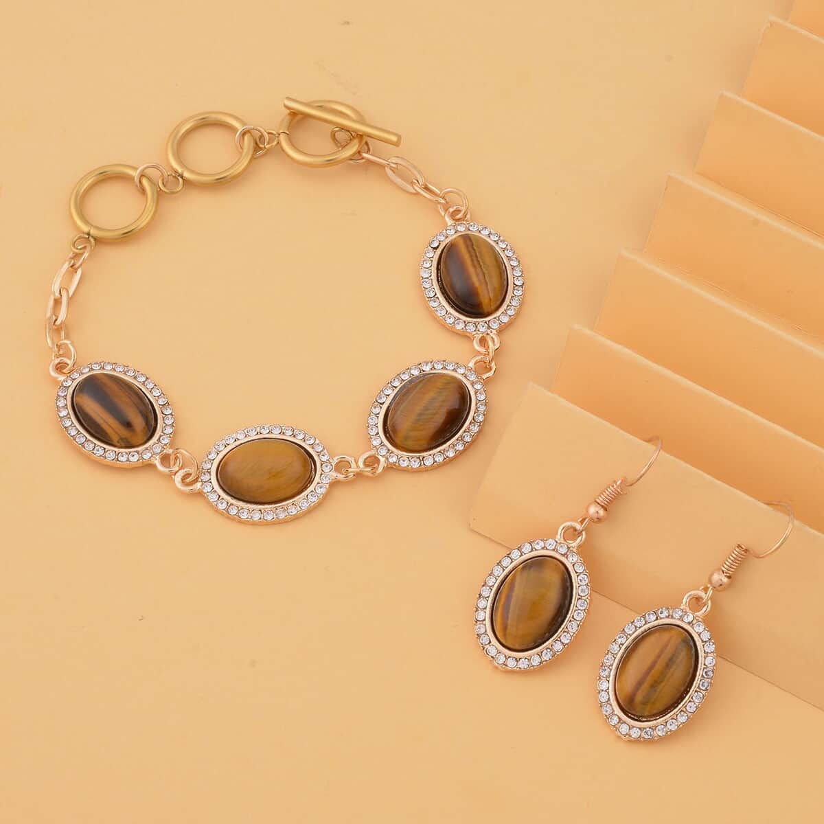 Yellow Tiger's Eye and White Austrian Crystal 56.00 ctw Bracelet (6.50-8.0In) and Earrings in Goldtone image number 1