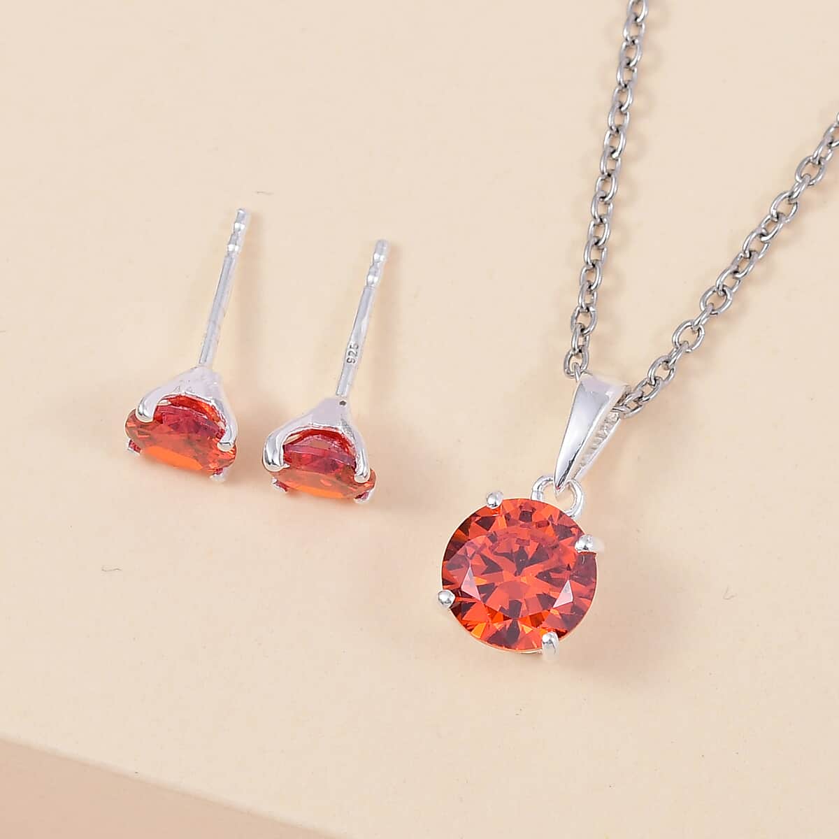 Simulated Orange Diamond Solitaire Stud Earrings and Pendant in Sterling Silver with Stainless Steel Necklace 20 Inches image number 1