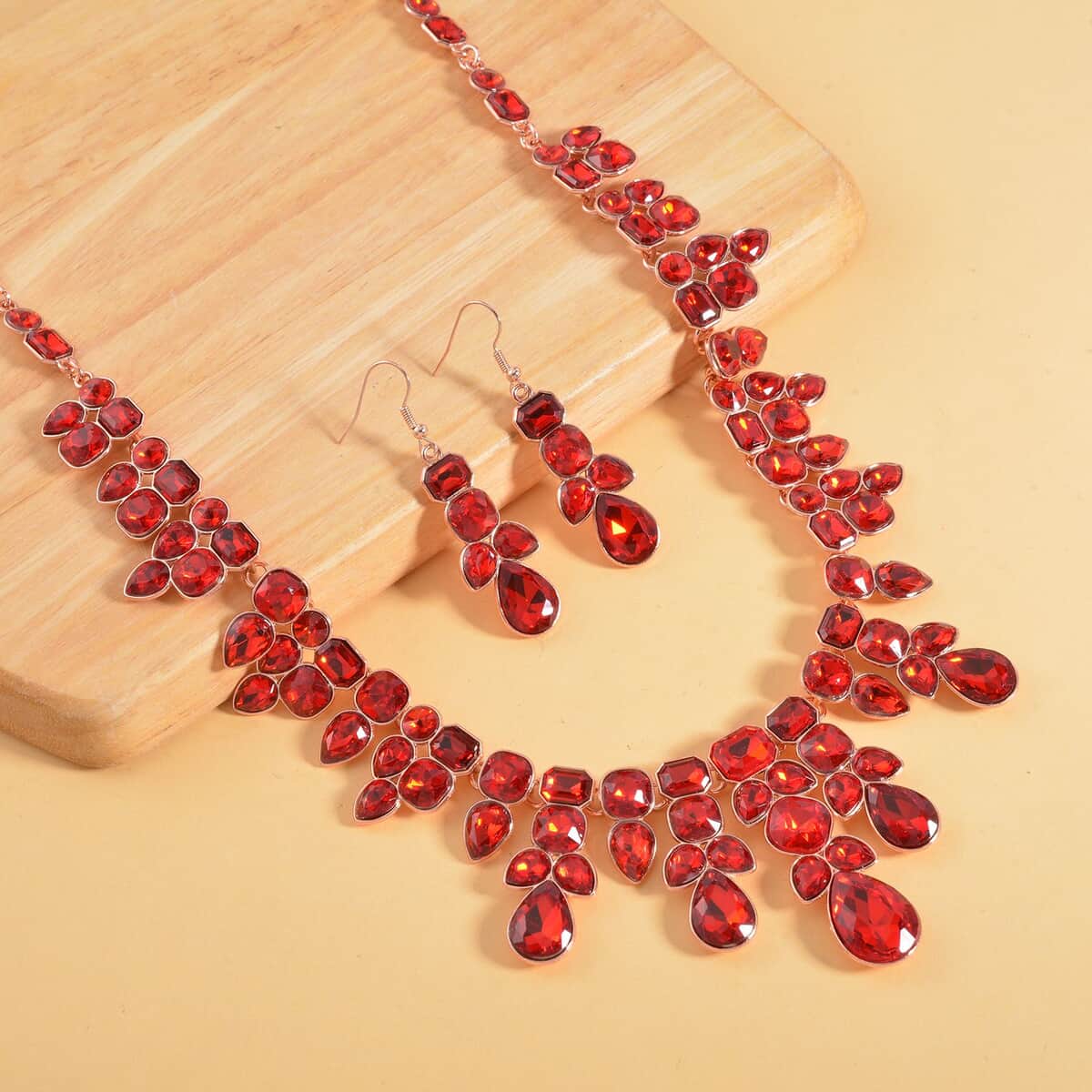 Red Austrian Crystal Necklace 20-23 Inches and Dangle Earrings in Rosetone image number 1