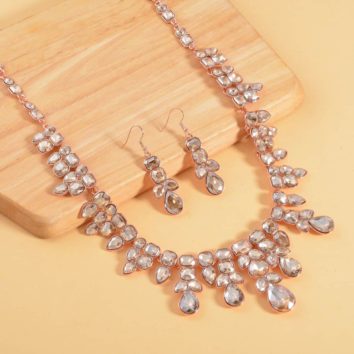Champagne Austrian Crystal Necklace 20-23 Inches and Dangle Earrings in Rosetone image number 1