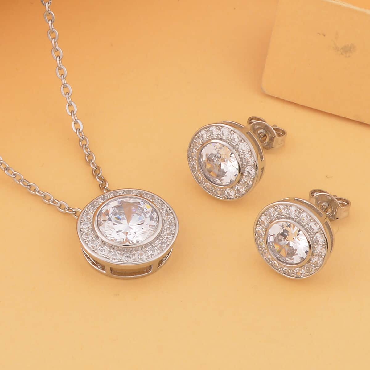 Simulated White Diamond Halo Pendant Necklace 20 Inches and Stud Earrings in Silvertone 6.90 ctw image number 1