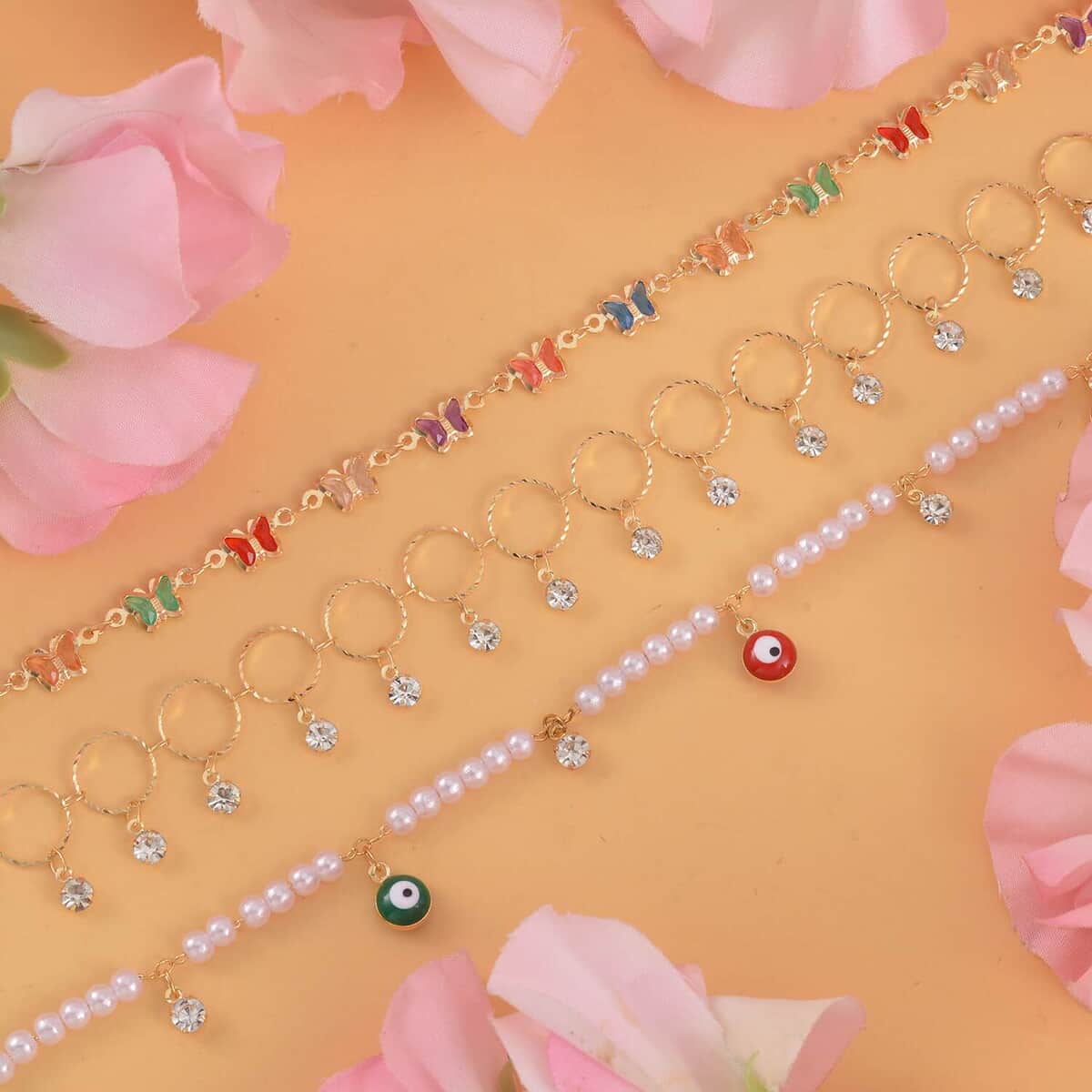 Simulated Pearl, Resin and Austrian Crystal Set of 3 Flower, Evil Eye & Butterfly Anklet in Goldtone (9-11In & 8.5-10.5In) image number 1