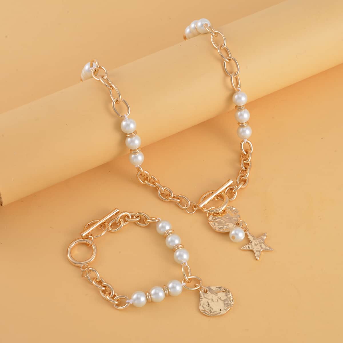 Simulated Pearl, Enameled Nugget and Star Charm Necklace 20-22 Inches and Bracelet (7.50-9.50In) in Goldtone image number 1