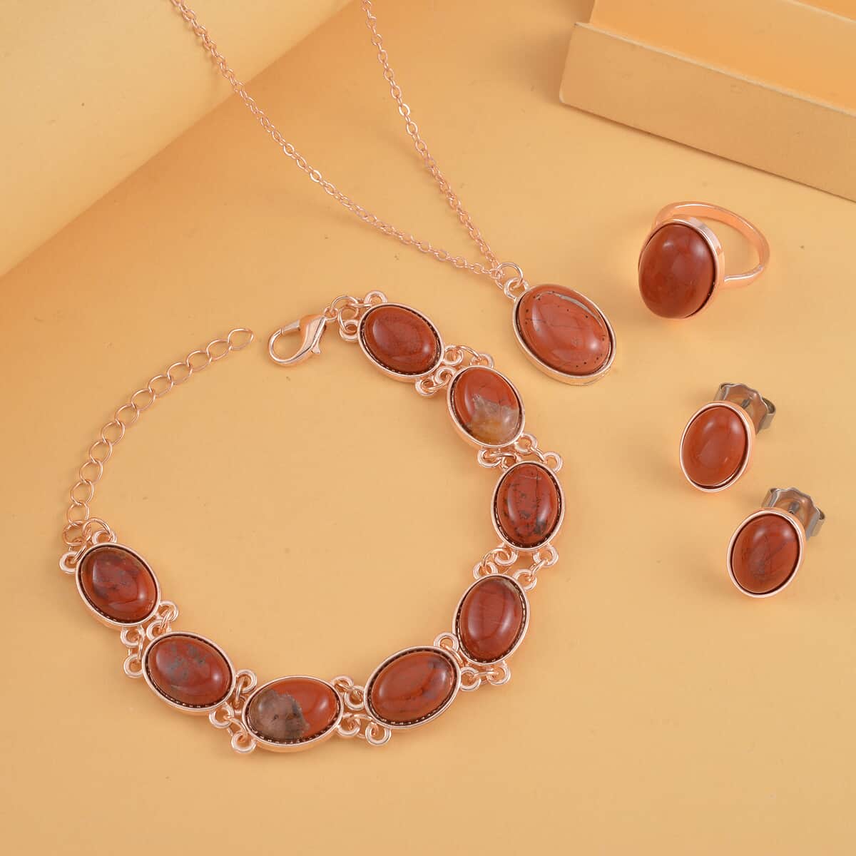 Red Jasper Bracelet (7.5-9.5In), Stud Earrings, Ring (Size 6.0) and Pendant Necklace 18 Inches in Rosetone 110.00 ctw image number 1