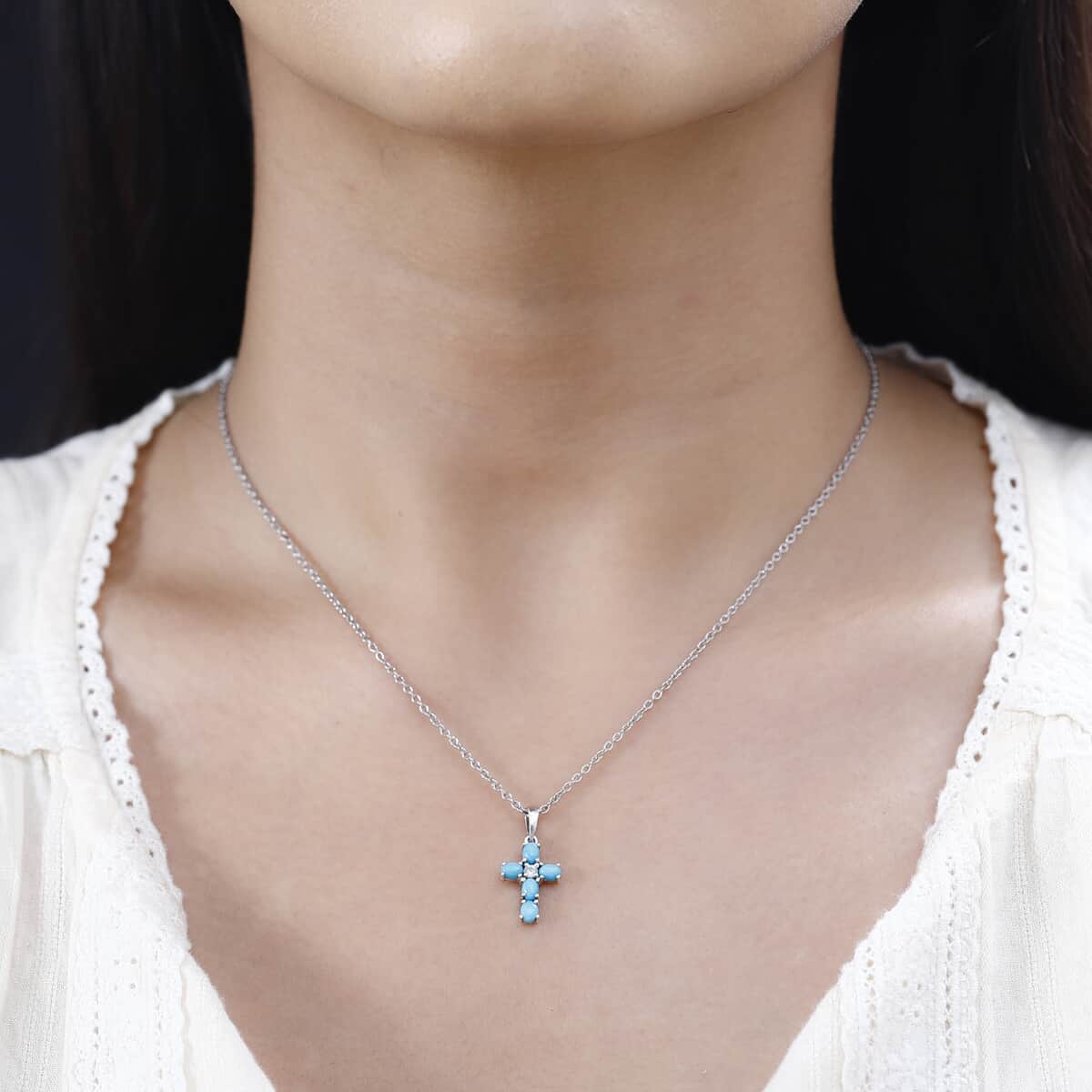 Sleeping Beauty Turquoise and White Zircon Cross Pendant in Platinum Over Sterling Silver with Stainless Steel Necklace 20 Inches 0.90 ctw image number 1