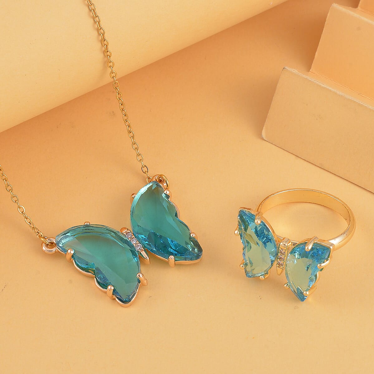 Simulated Sky Blue Topaz, Simulated Diamond Butterfly Ring (Size 6.0) and Necklace 20-22 Inches in Goldtone image number 1