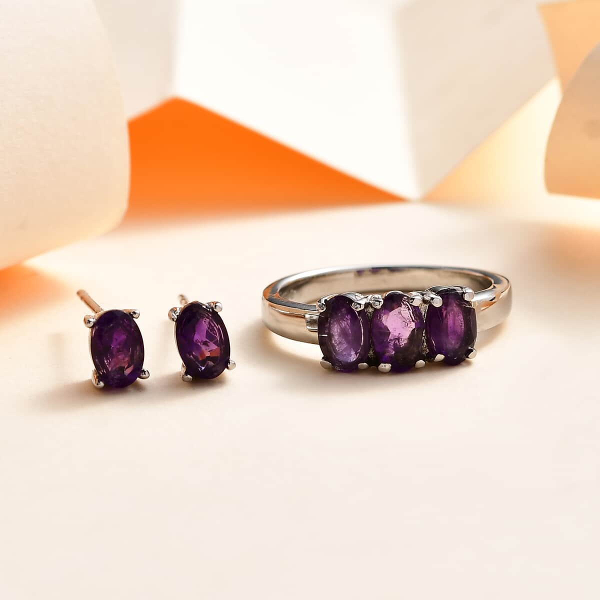 Amethyst 3 Stone Ring and Solitaire Stud Earrings in Stainless Steel 2.20 ctw image number 1