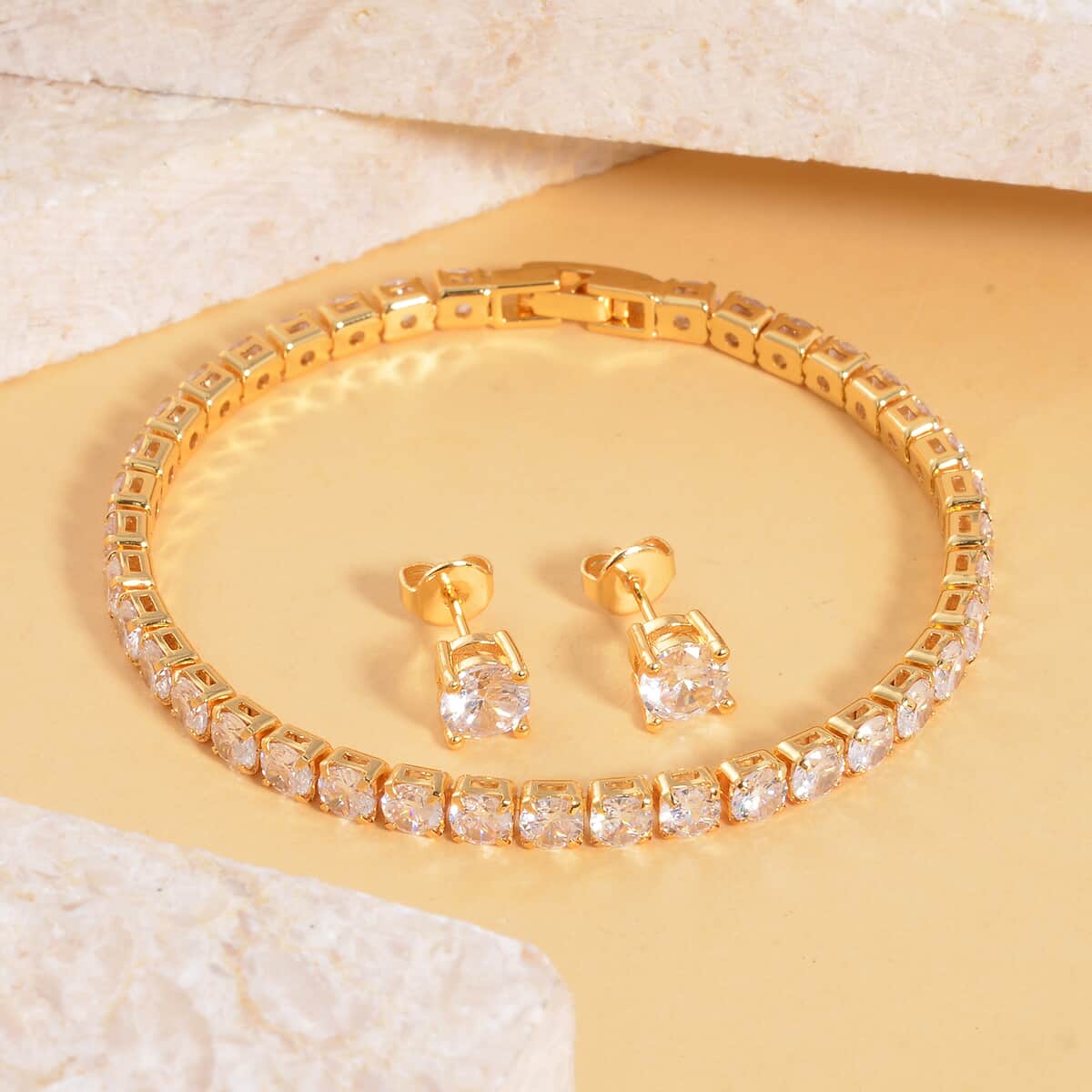 Simulated Diamond Stud Earrings and Tennis Bracelet (7.00 In) in Goldtone 27.90 ctw image number 1