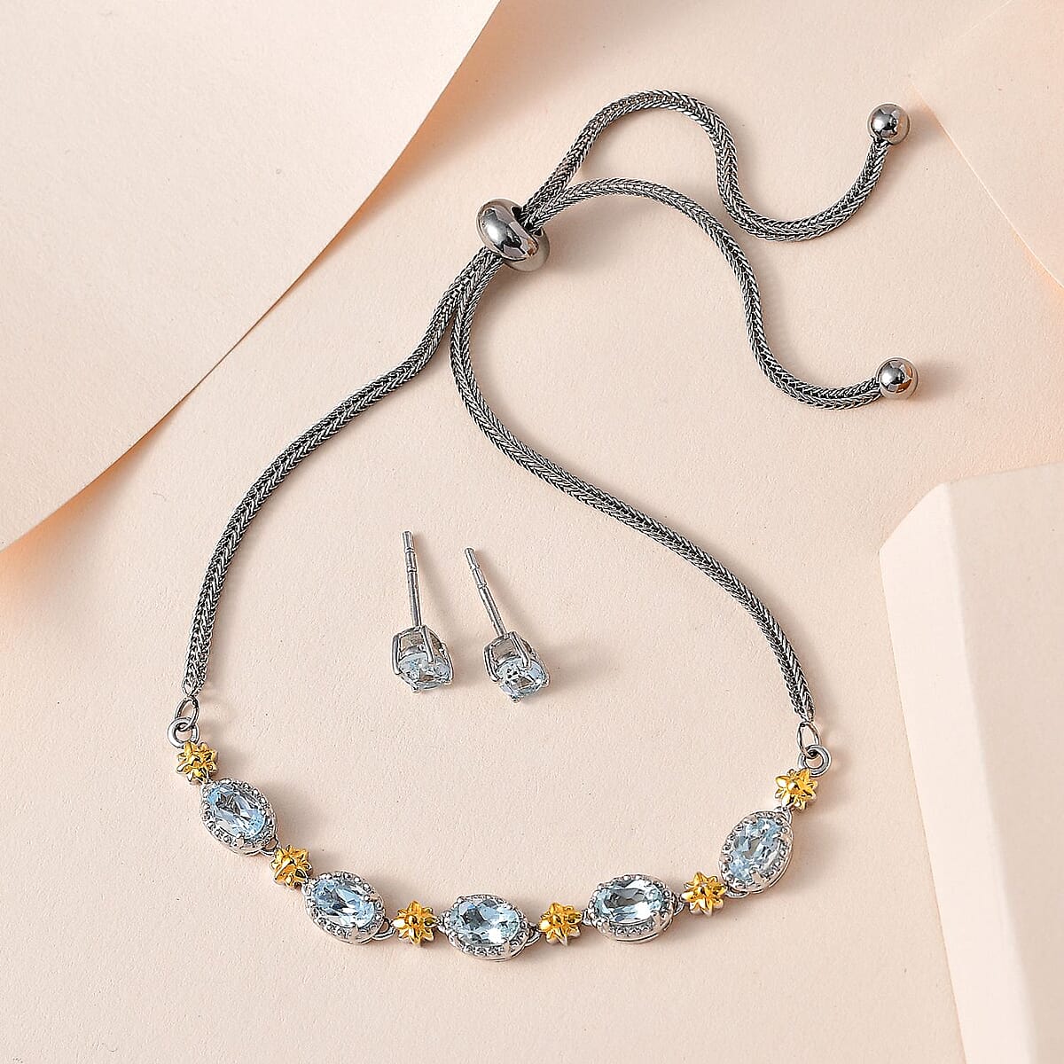 Karis Sky Blue Topaz Solitaire Stud Earrings and Bolo Bracelet in 18K YG Plated, Platinum Bond and Stainless Steel 3.75 ctw image number 1