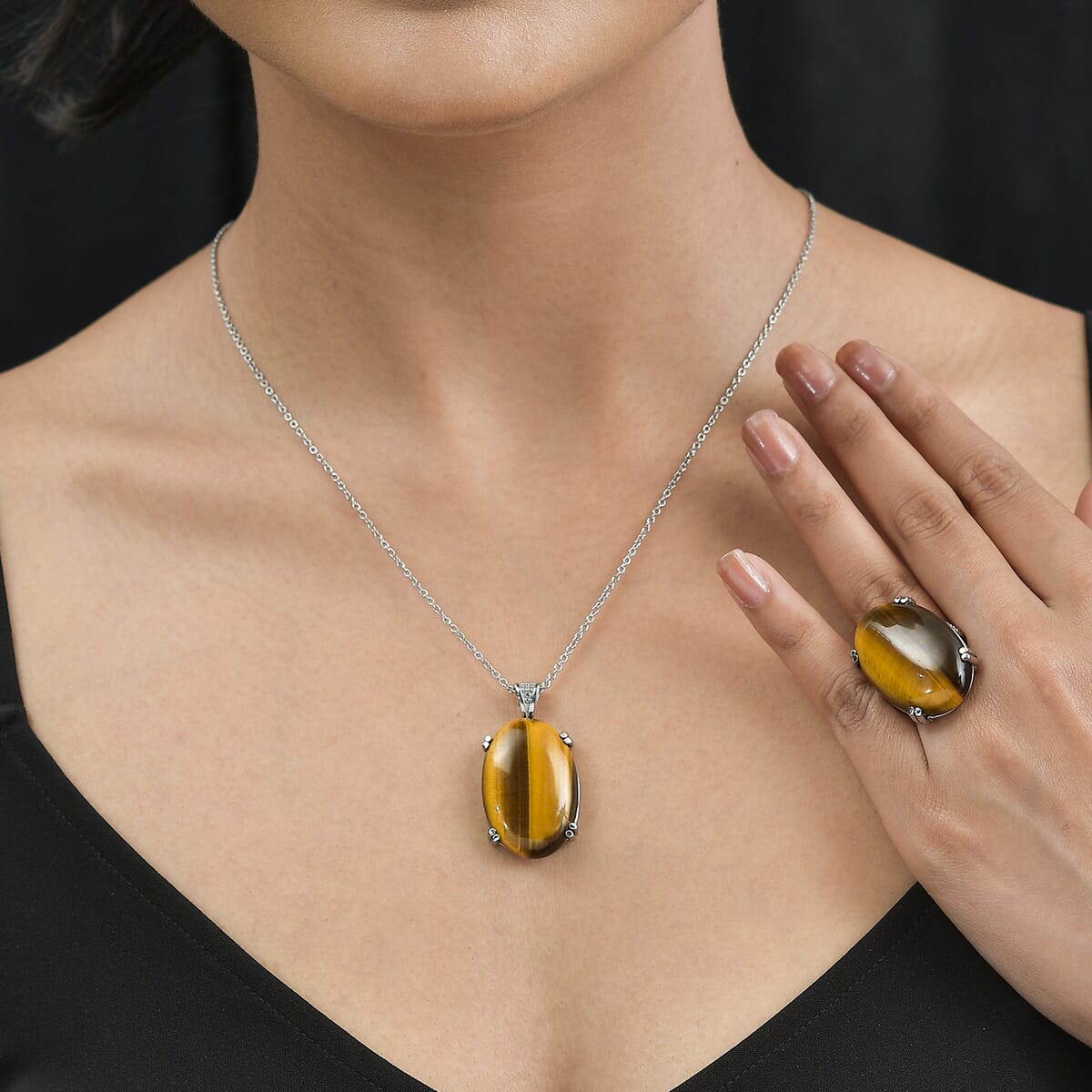 Tiger's Eye Solitaire Ring (Size 5.0) and Pendant Necklace (20 Inches) in Stainless Steel 65.75 ctw image number 2
