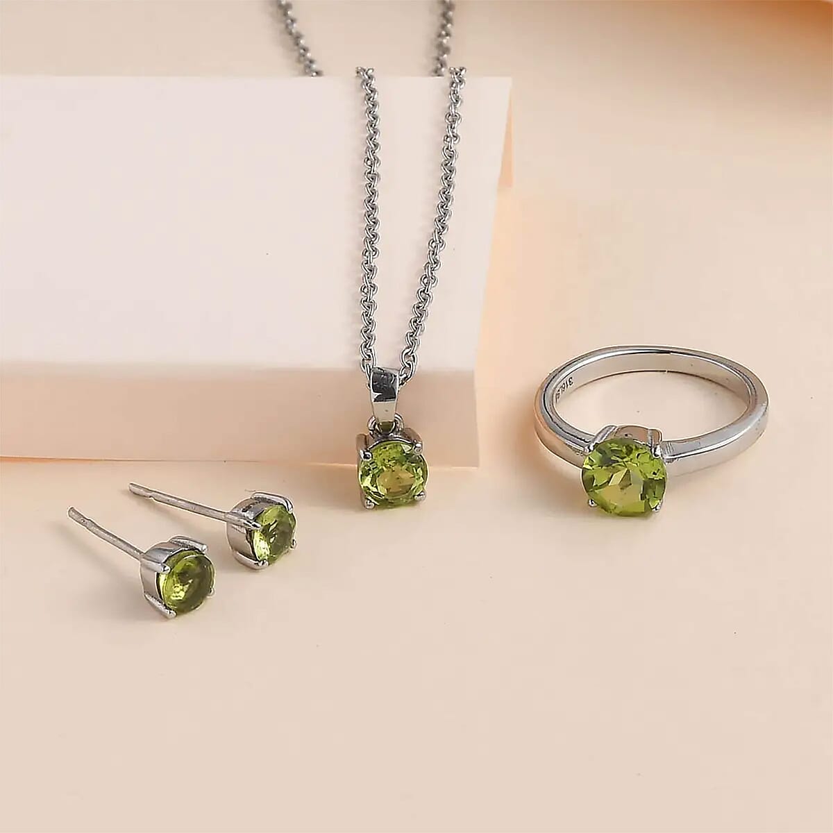 Peridot Solitaire Stud Earrings, Ring (Size 8.0) and Pendant Necklace 20 Inches in Stainless Steel 3.25 ctw image number 1