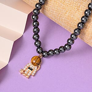 Yellow Tiger's Eye and Simulated Diamond Spaceman Pendant with Hematite Beaded Necklace 20 Inches in Goldtone 426.00 ctw
