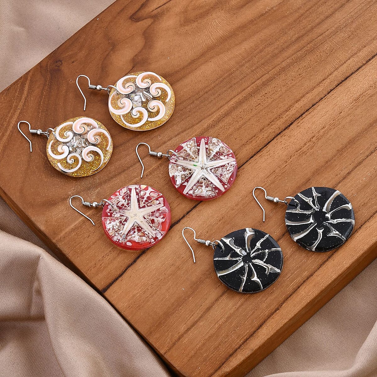 Set of 3 Resin Spider Net, Hurricane and Star Earrings in Sterling Silver image number 1