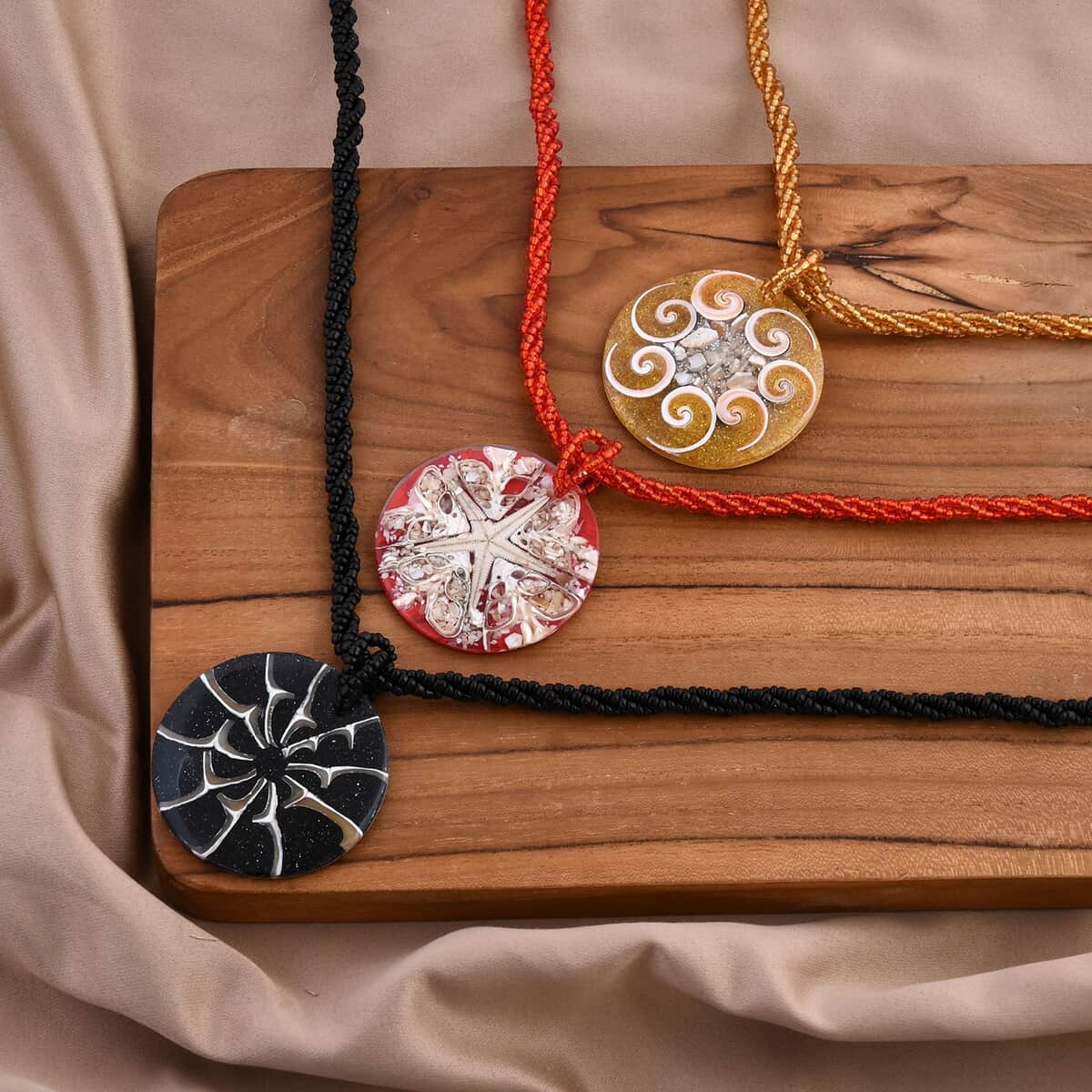 Resin Pendant Set of 3 Spider Net, Hurricane, and Star Motif With Matching Seed Beads Necklace (20 Inches) image number 1