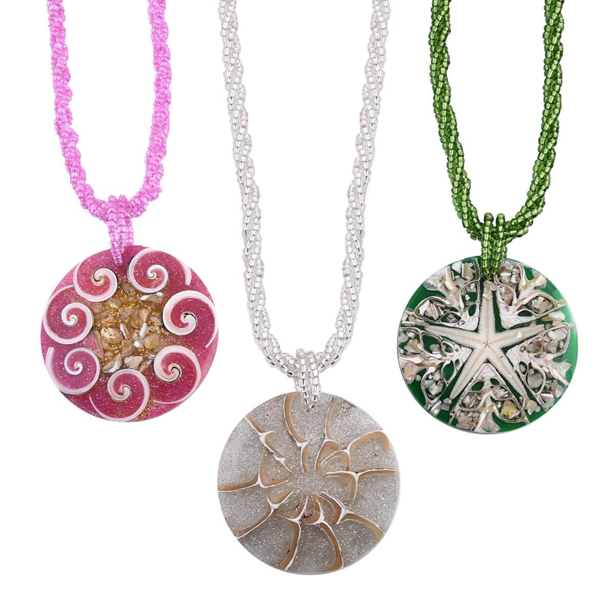 Multi Color Resin Pendant Set of 3 Spider Net, Hurricane, and Star Motif With Matching Seed Beads Necklace 20 Inches image number 0