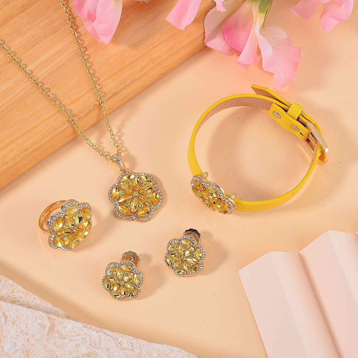 Gold and White Austrian Crystal, Faux Leather Floral Bracelet (6-8In), Earrings, Ring (Size 10.0) and Pendant Necklace 20-22 Inches In Goldtone image number 1