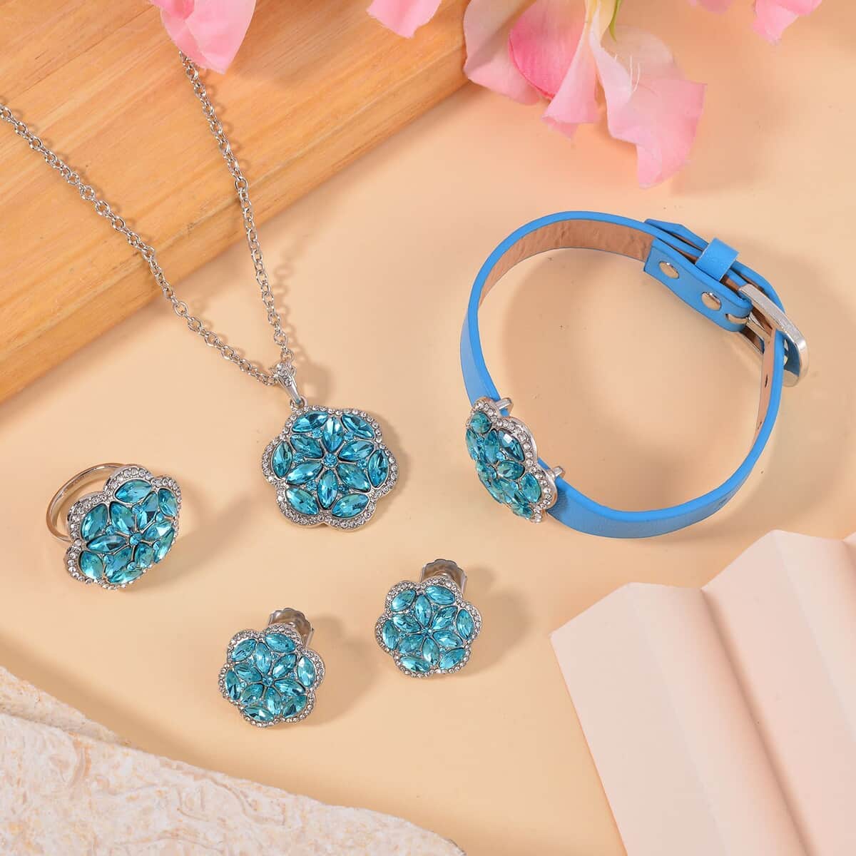 Sky Blue Color and White Austrian Crystal, Faux Leather Floral Bracelet (6-8In), Earrings, Ring (Size 7.0) and Pendant Necklace 20-22 Inches In Silvertone image number 1