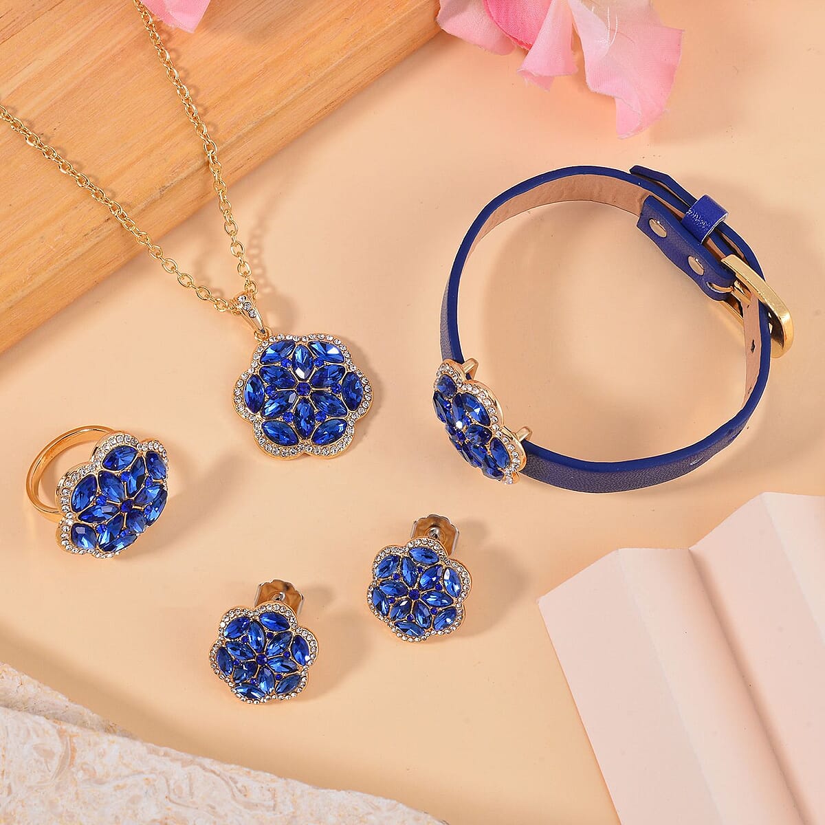 Sapphire Blue Color and White Austrian Crystal, Faux Leather Floral Bracelet (6-8In), Earrings, Ring (Size 10.0) and Pendant Necklace 20-22 Inches In Goldtone image number 1