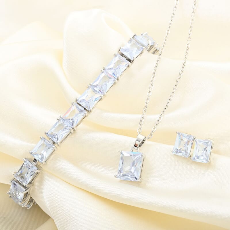 3 Piece Set - Light Blue Crystal Bracelet, Solitaire Stud Earrings and Pendant in Silvertone with Stainless Steel Necklace (20 Inches)
