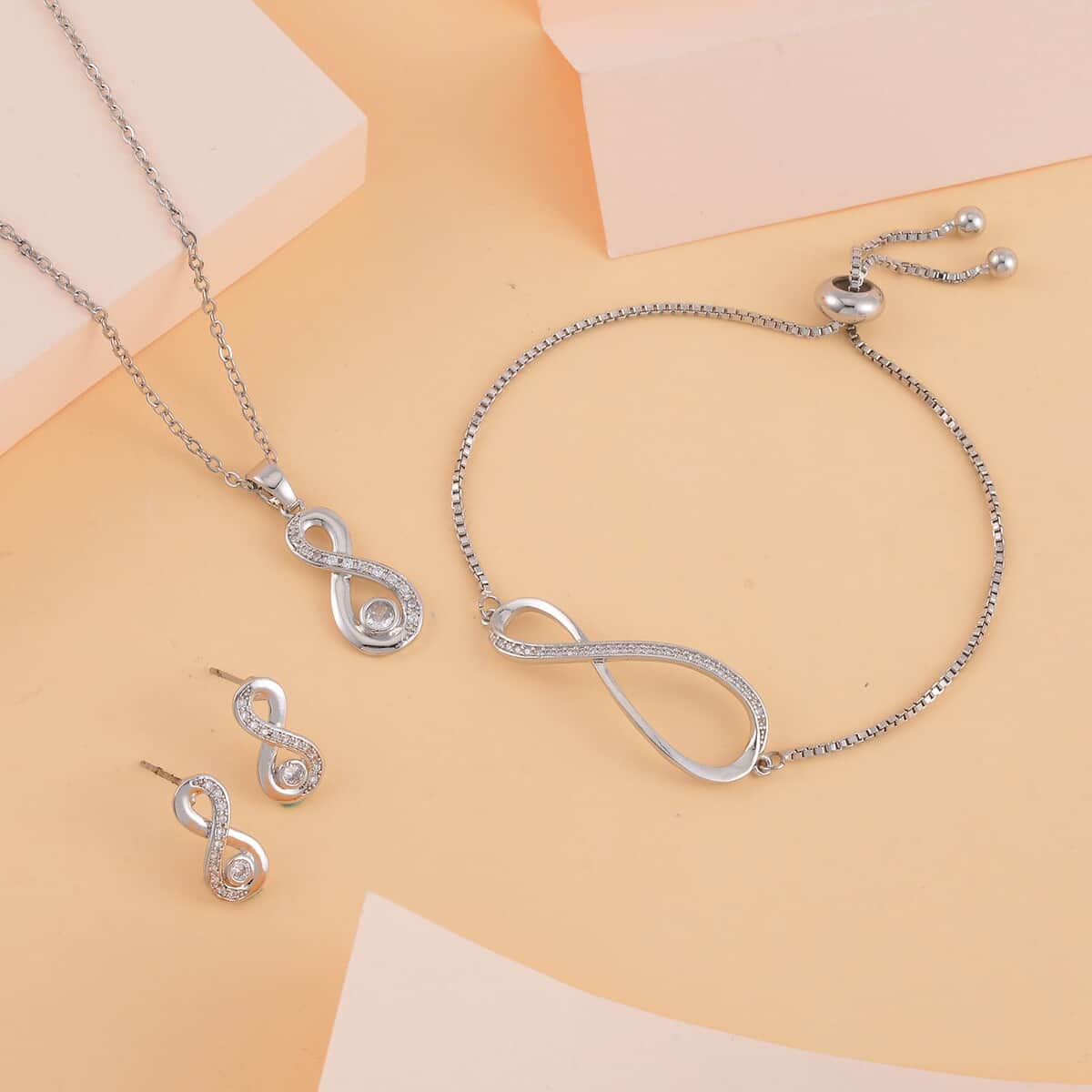 Simulated Diamond Infinity Necklace 20-22 Inches, Bolo Bracelet and Earrings in Silvertone 0.50 ctw image number 1