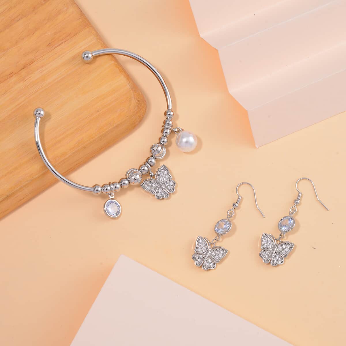 Simulated Pearl, Simulated Diamond and Austrian Crystal Earrings and Cuff Bracelet (7.00 In) with Butterfly Charm in Silvertone 0.80 ctw image number 1