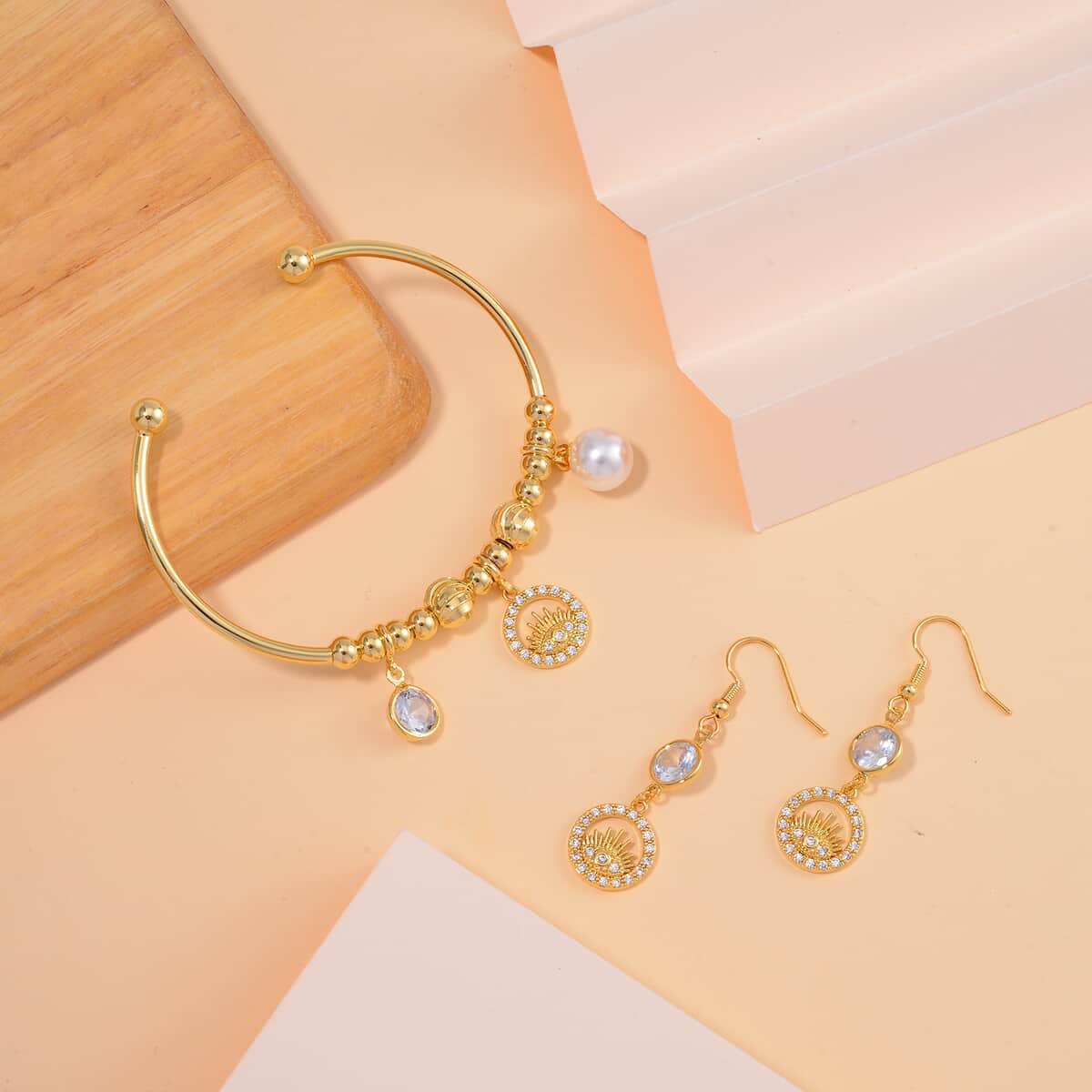 Simulated Pearl, Simulated Diamond, Austrian Crystal Bangle Bracelet (7.00In) and Earrings with Evil Eye Charm in Goldtone 0.90 ctw image number 1