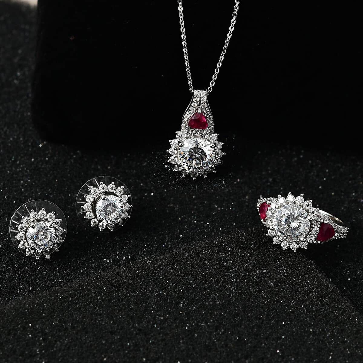 120 Facet Moissanite and Niassa Ruby (FF) Stud Earrings, Ring (Size 9.0) and Pendant Necklace 20 Inches in Platinum Over Sterling Silver 8.20 ctw image number 1