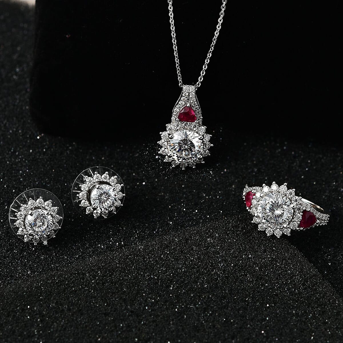 120 Facet Moissanite and Niassa Ruby (FF) Stud Earrings, Ring (Size 10.0) and Pendant Necklace 20 Inches in Platinum Over Sterling Silver 8.20 ctw image number 1