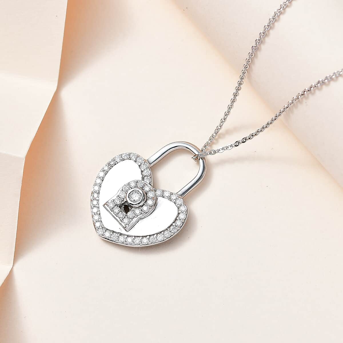 Moissanite Heart Padlock Pendant Necklace 20 Inches in Platinum Over Sterling Silver 0.60 ctw image number 1