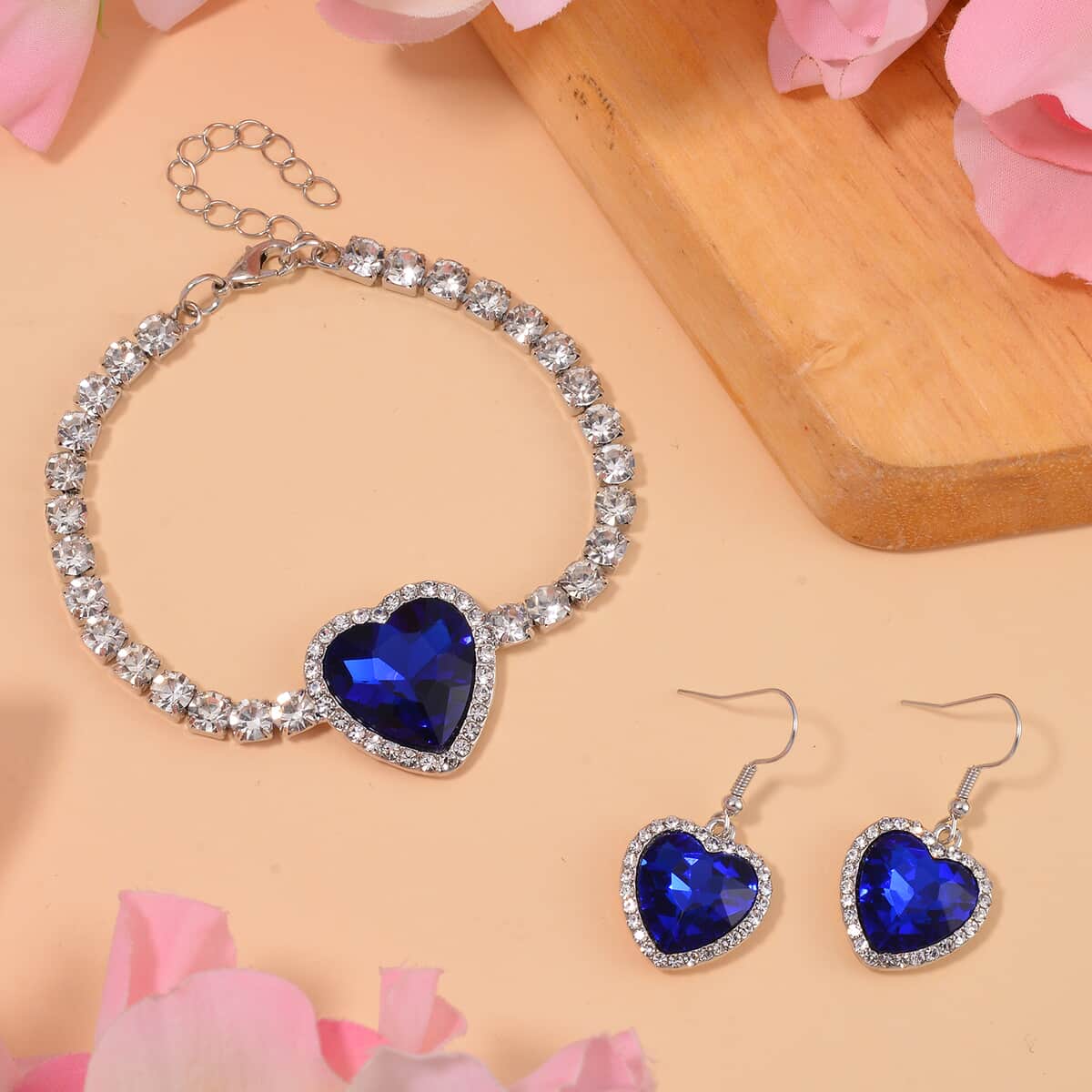 Sapphire Blue Glass and Austrian Crystal Heart Bracelet (7.50-9.50In) and Earrings in Silvertone image number 1