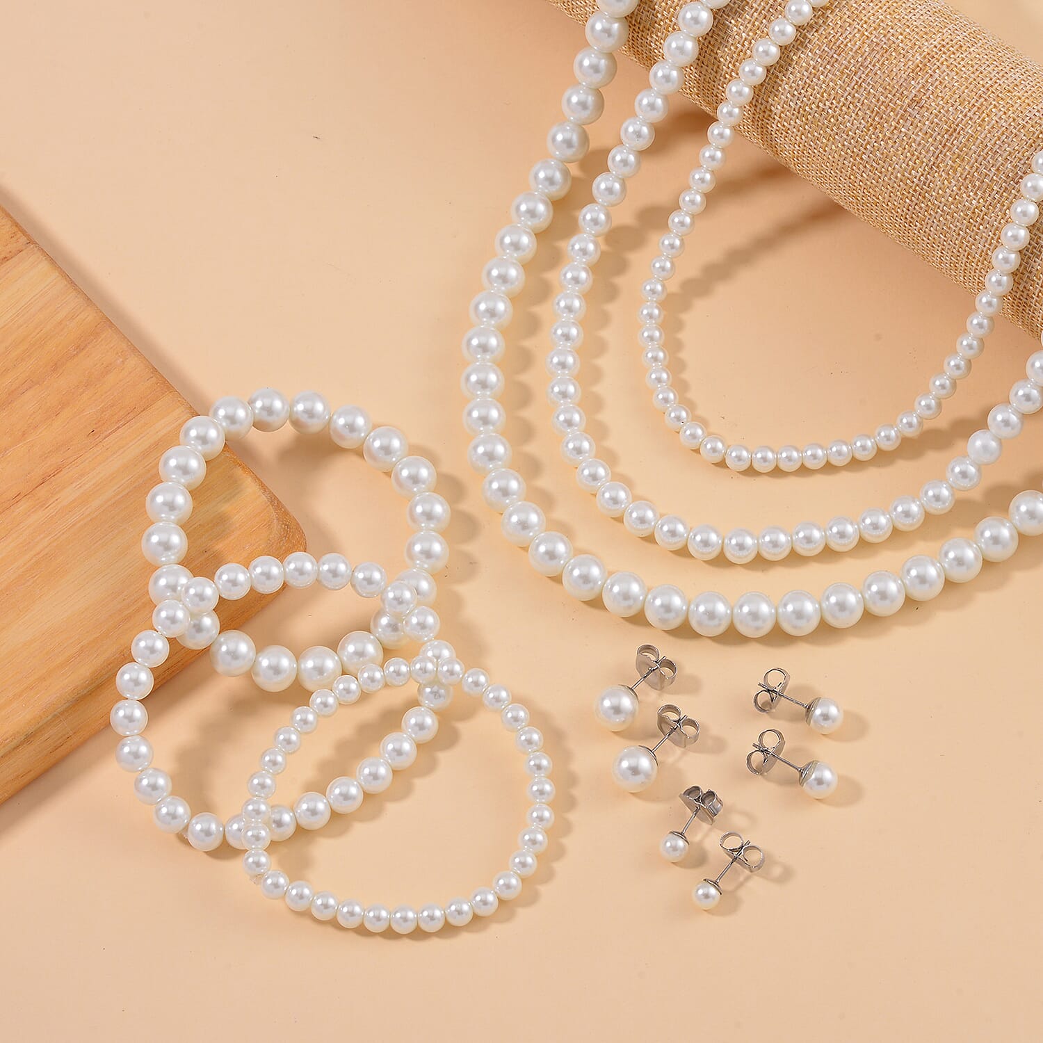 Set with Bow Ribbon Burgundy Packaging 9pcs Set White Color Constituted Shell Pearl Stretch Bracelet, Earrings and Necklace (20-22 Inches) in Stainless Steel
