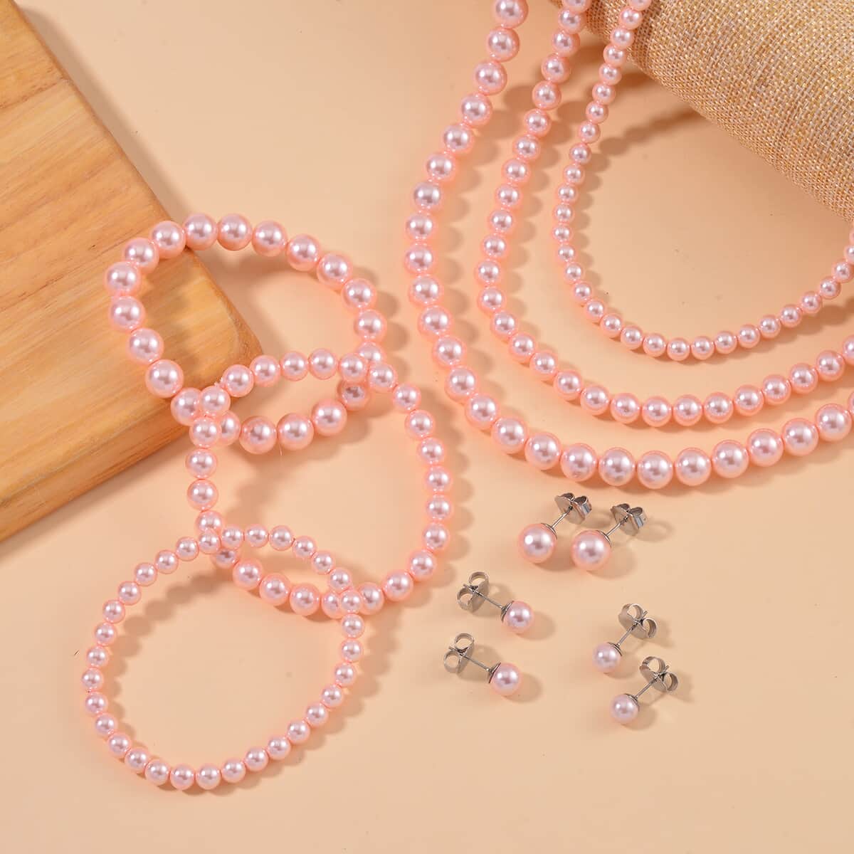 Set with Bow Ribbon Ivory Packaging 9pcs Set Peach Color Constituted Shell Pearl Stretch Bracelet, Earrings and Necklace 20-22 Inches in Stainless Steel image number 1