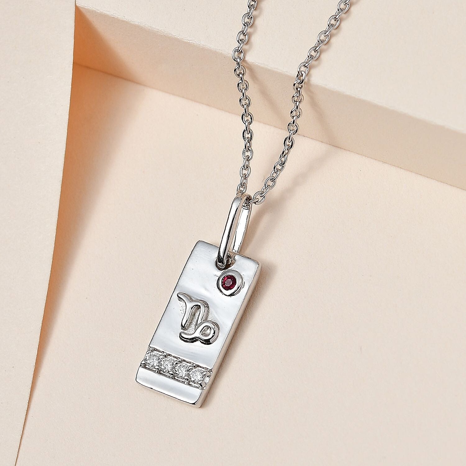 Orissa Rhodolite Garnet and Moissanite Capricorn Zodiac Pendant Necklace 20 Inches in Platinum Over Sterling Silver 0.15 ctw