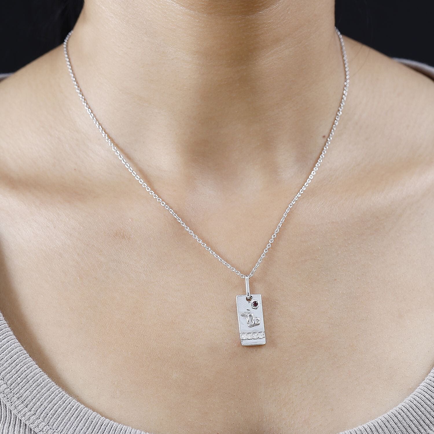 Orissa Rhodolite Garnet and Moissanite Capricorn Zodiac Pendant Necklace 20 Inches in Platinum Over Sterling Silver 0.15 ctw