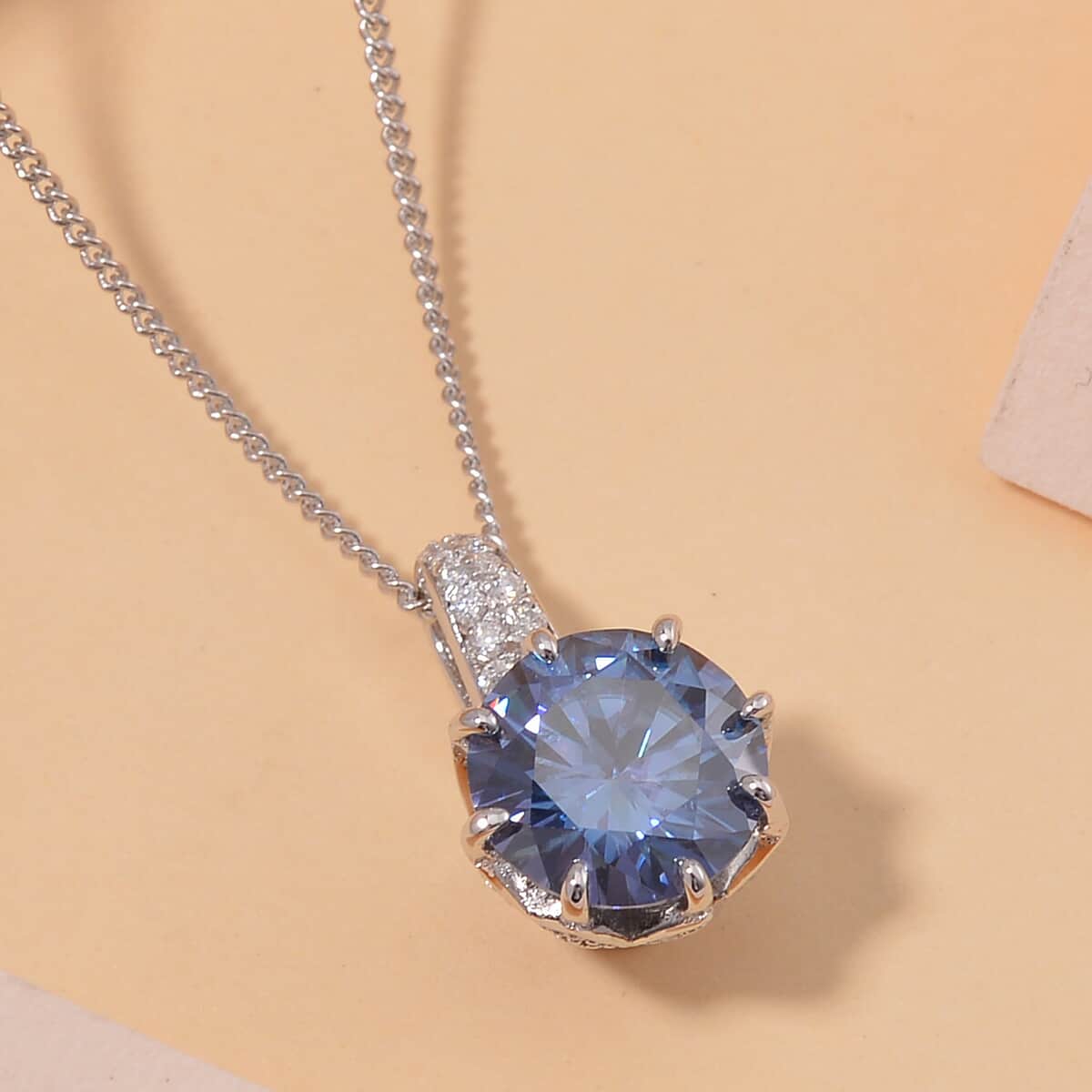 Sapphire Blue Moissanite (Ovl 7x5mm), Moissanite Crown of Petals Pendant Necklace (20 Inches) in Rhodium Over Sterling Silver 2.70 ctw image number 1