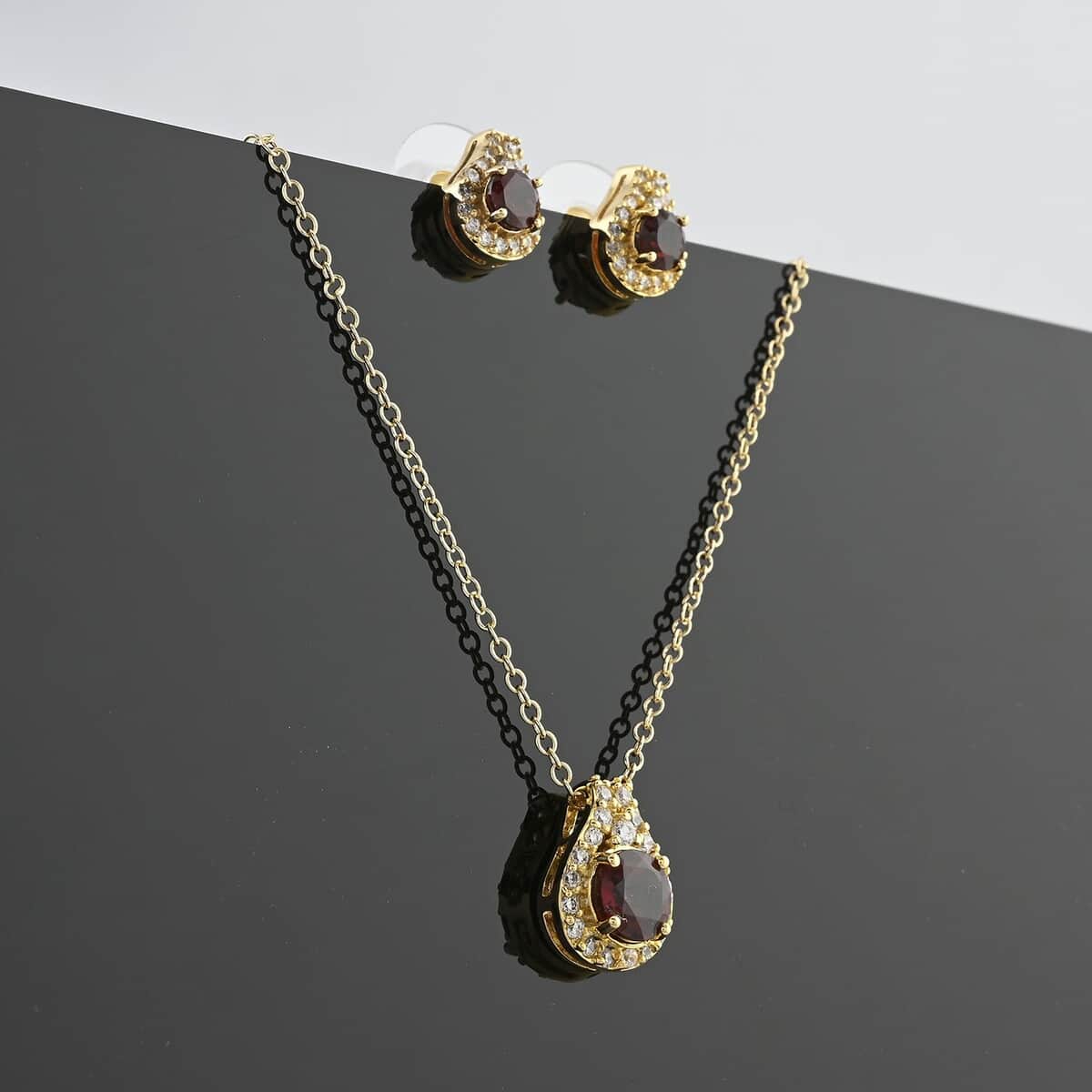 Simulated Garnet and Simulated Diamond 2.90 ctw Earrings, Pendant Necklace 18 Inches in Goldtone image number 1