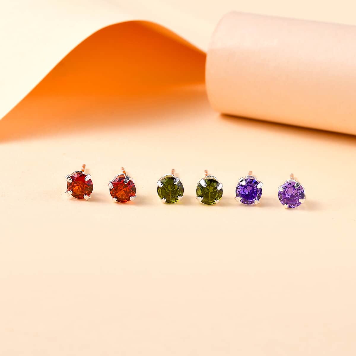 Set of 3 Simulated Purple, Red and Peridot Color Diamond 4.50 ctw Stud Earrings in Sterling Silver  image number 1