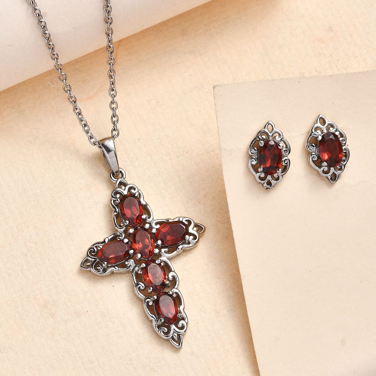 Mozambique Garnet 4.30 ctw Stud Earrings and Cross Pendant Necklace (20 Inches) in Stainless Steel image number 1