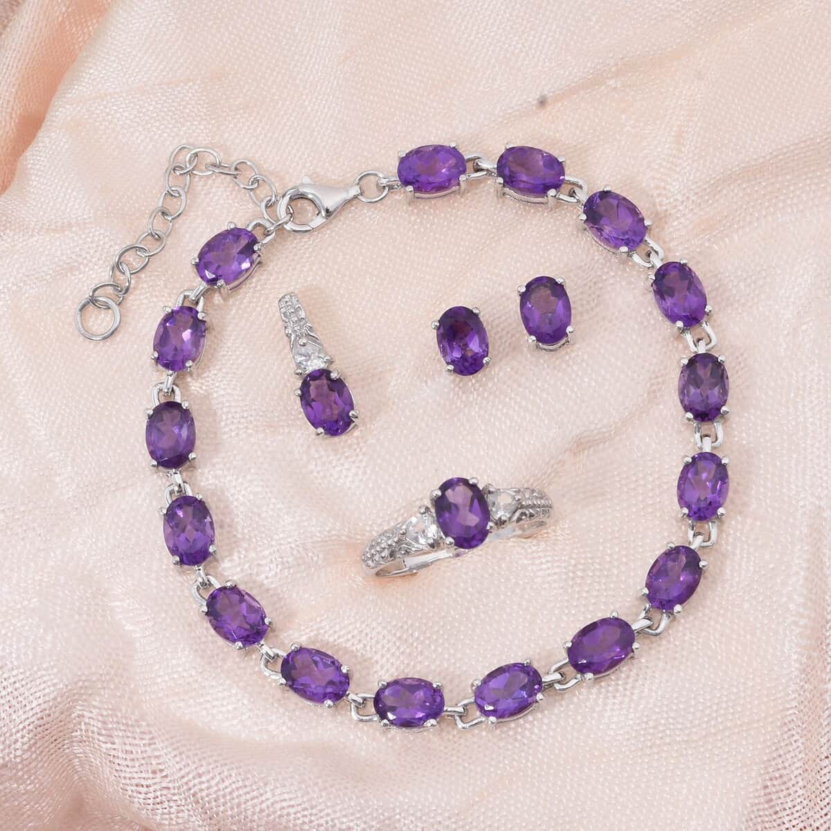 African Amethyst and White Topaz 16.50 ctw Ring (Size 7.0), Stud Earrings, Pendant and Bracelet (7.00In) in Rhodium Over Sterling Silver image number 1