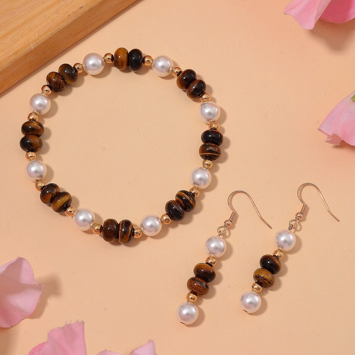 Tigers Eye 50.00 ctw and White Shell Pearl Bracelet (6.50-7.0In) and Earrings in Goldtone image number 1