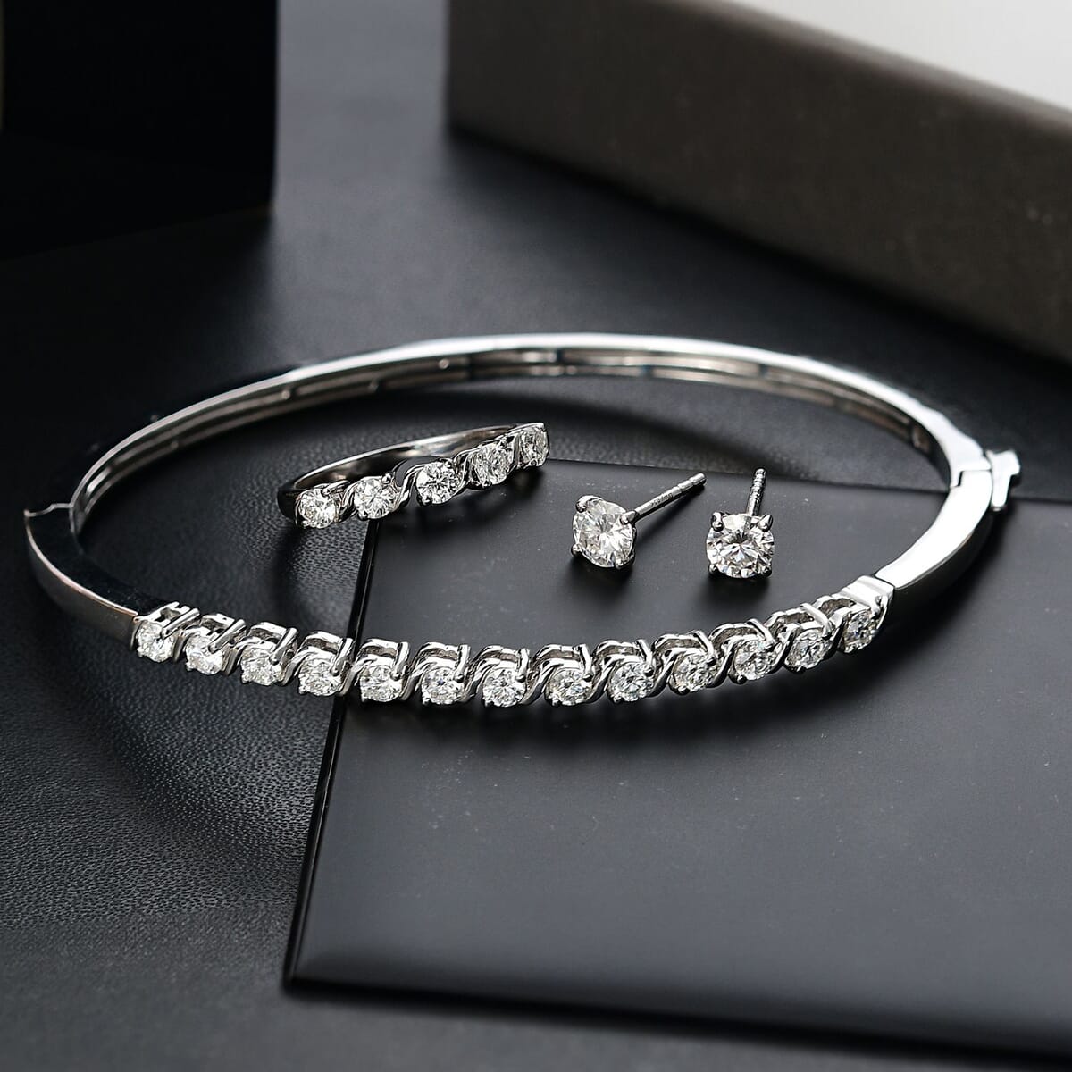 Set of 3 Moissanite 2.75 ctw Swirl Wave Bangle Bracelet (7.25In), Ring (Size 6.0) and Solitaire Stud Earrings in Rhodium Over Sterling Silver image number 1