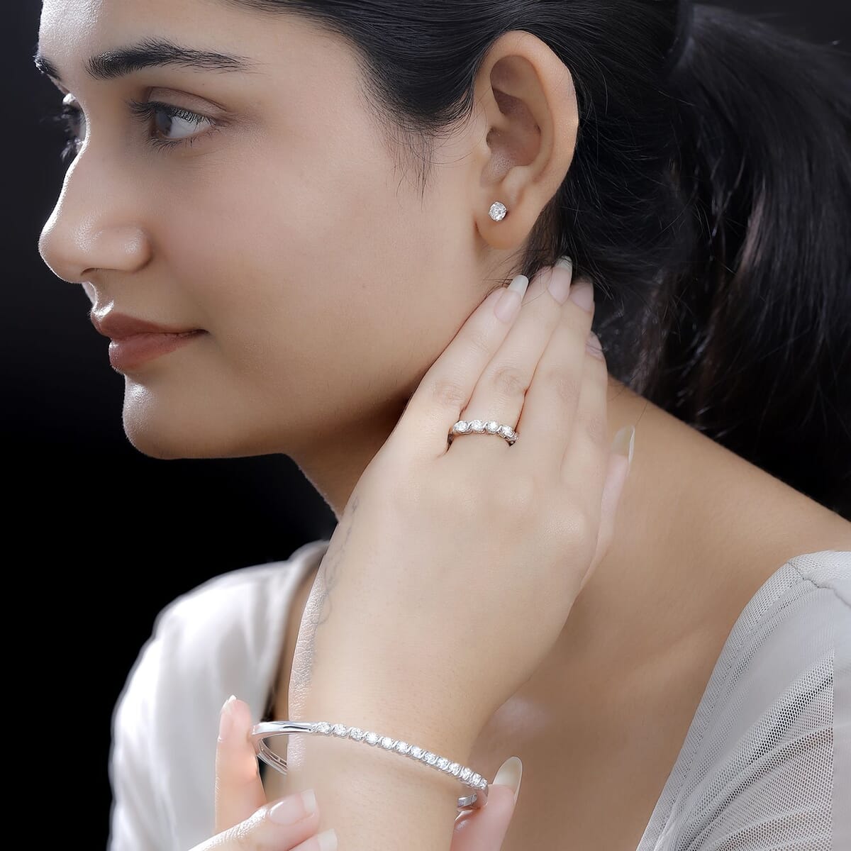 Set of 3 Moissanite 2.75 ctw Swirl Wave Bangle Bracelet (7.25In), Ring (Size 6.0) and Solitaire Stud Earrings in Rhodium Over Sterling Silver image number 2
