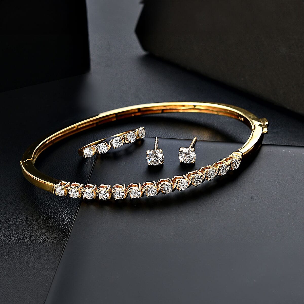 Set of 3 Moissanite 2.75 ctw Swirl Wave Bangle Bracelet (7.25In), Ring (Size 5.0) and Solitaire Stud Earrings in 18K Vermeil Yellow Gold Over Sterling Silver image number 1