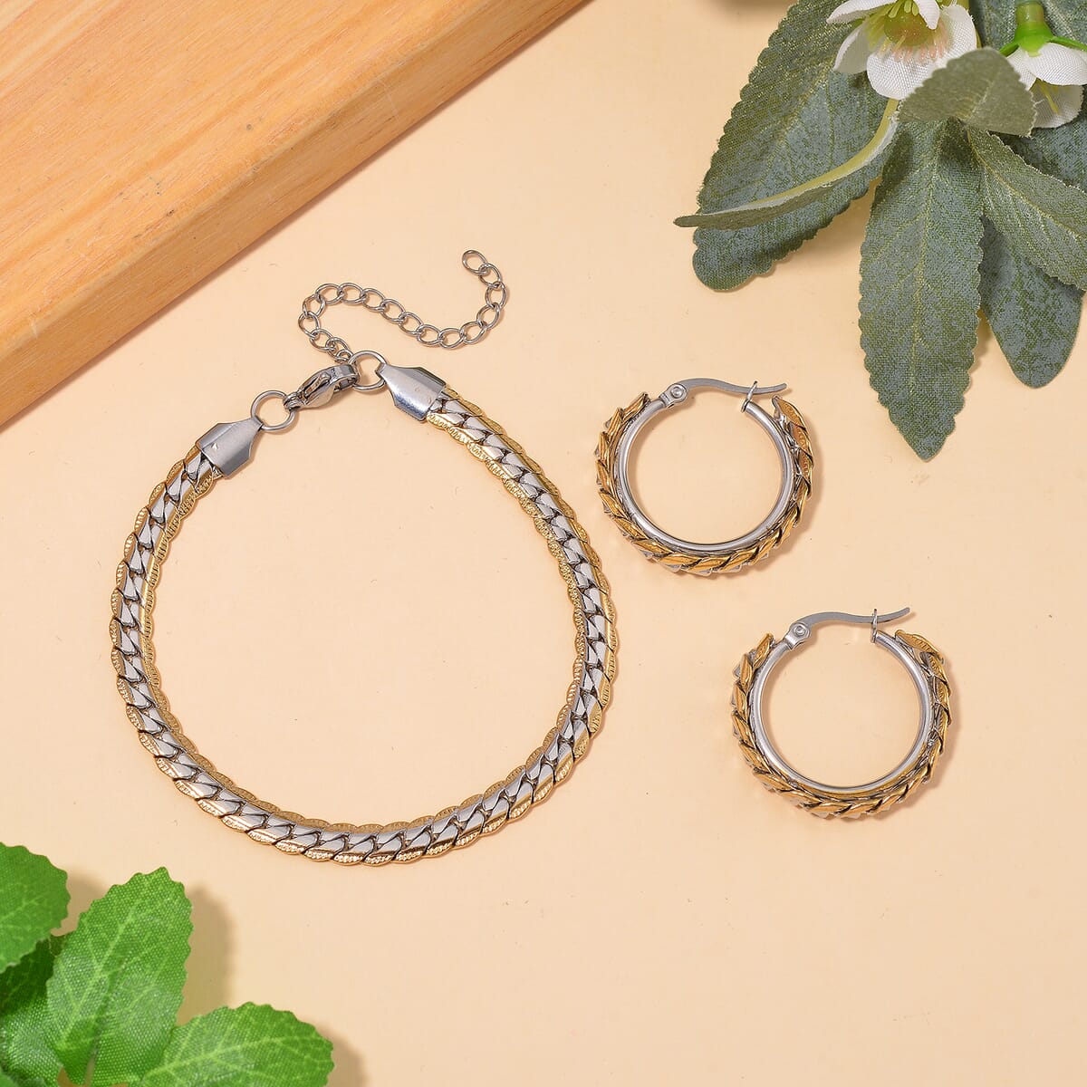 6mm Curb Chain Bracelet (7.50-9.50In) and Hoop Earrings in ION Plated YG and Stainless Steel image number 1