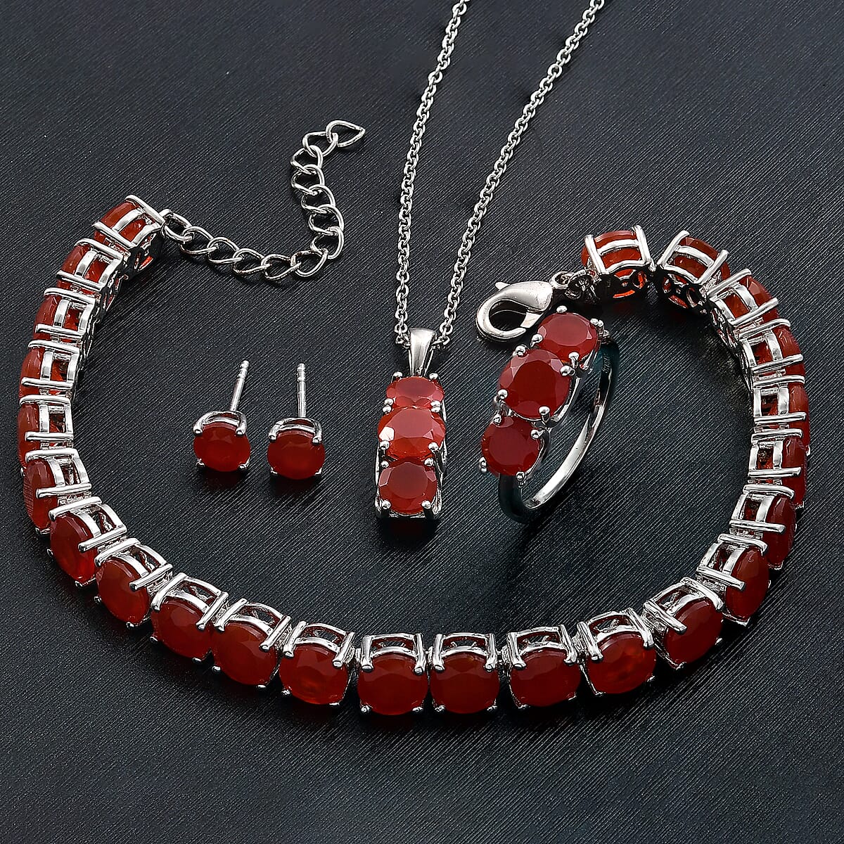 Karis Red Onyx 38.20 ctw Bracelet (7.25In), Stud Earrings, 3 Stone Ring (Size 5.0) and Pendant in Platinum Bond with Stainless Steel Necklace 20 Inches image number 1
